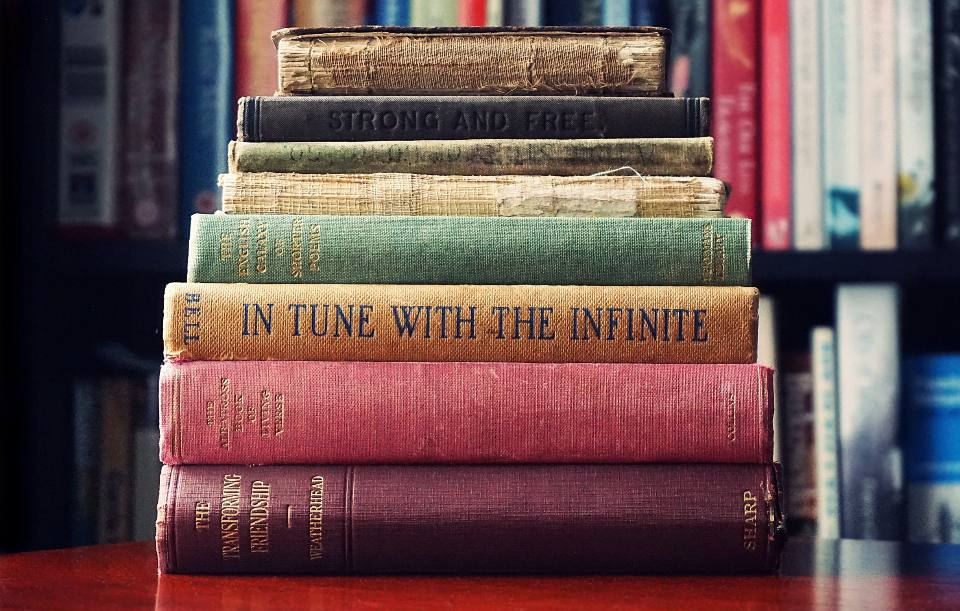 A stack of vintage cloth-bound books